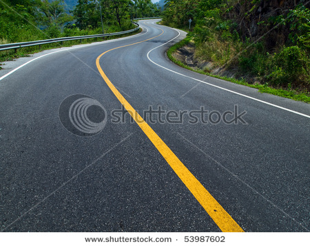 stock-photo-the-road-curves-up-the-mountain-line-yellow-and-white-road-53987602.jpg