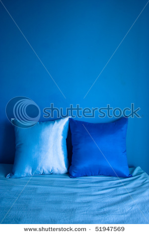 stock-photo-blue-pillow-on-a-blue-badroom-51947569.jpg