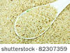 stock-photo-white-rice-uncooked-waiting-to-ripen-in-a-plastic-spoon-82307359.jpg