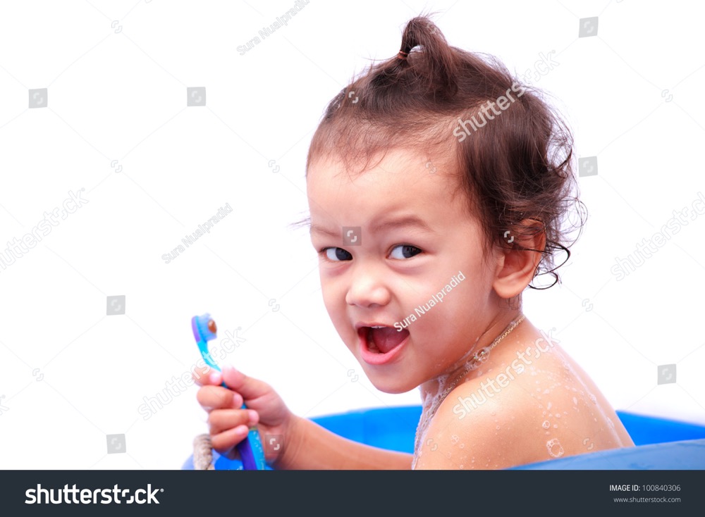 stock photo baby holding toothbrush in his hand on white background 100840306